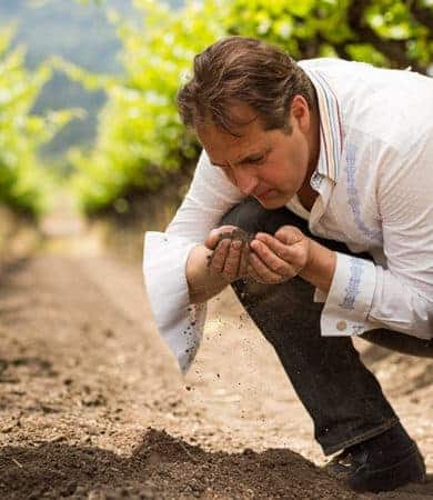 Ivo-holding-dirt-vineyard