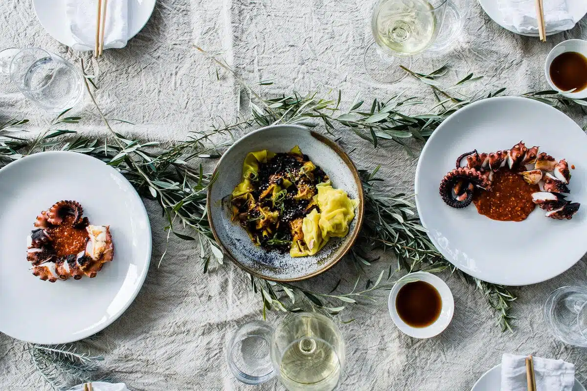 01-22-food-and-wine-pairing-guide table with plates of food
