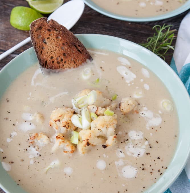 Plate,Of,Creamy,Soup,With,Roasted,Cauliflower,And,Spring,Onions