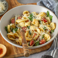 Traditional,Orecchiette,Pasta,Recipe,With,Kale,And,Fried,Sausages,Close-up