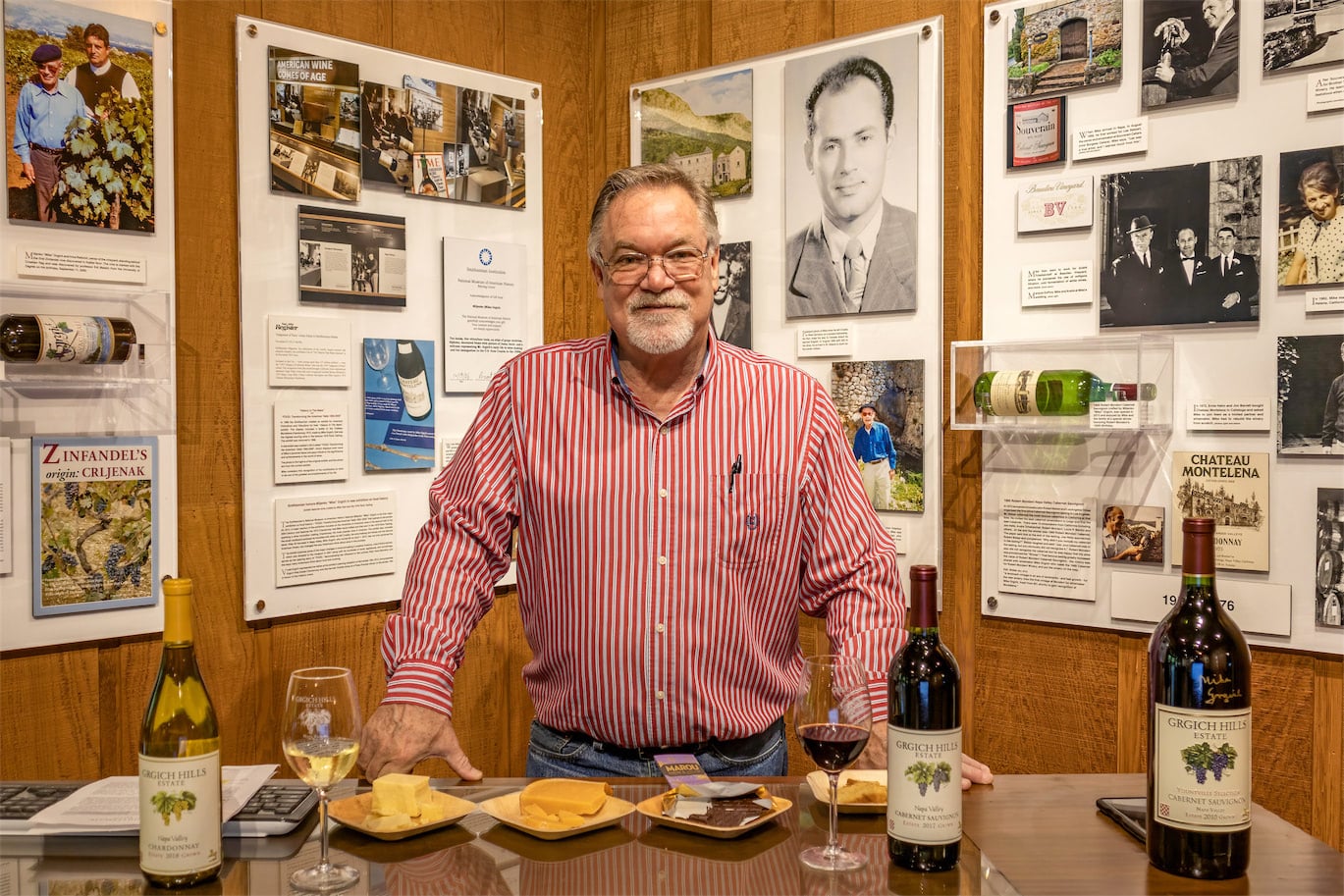 man standing behind table