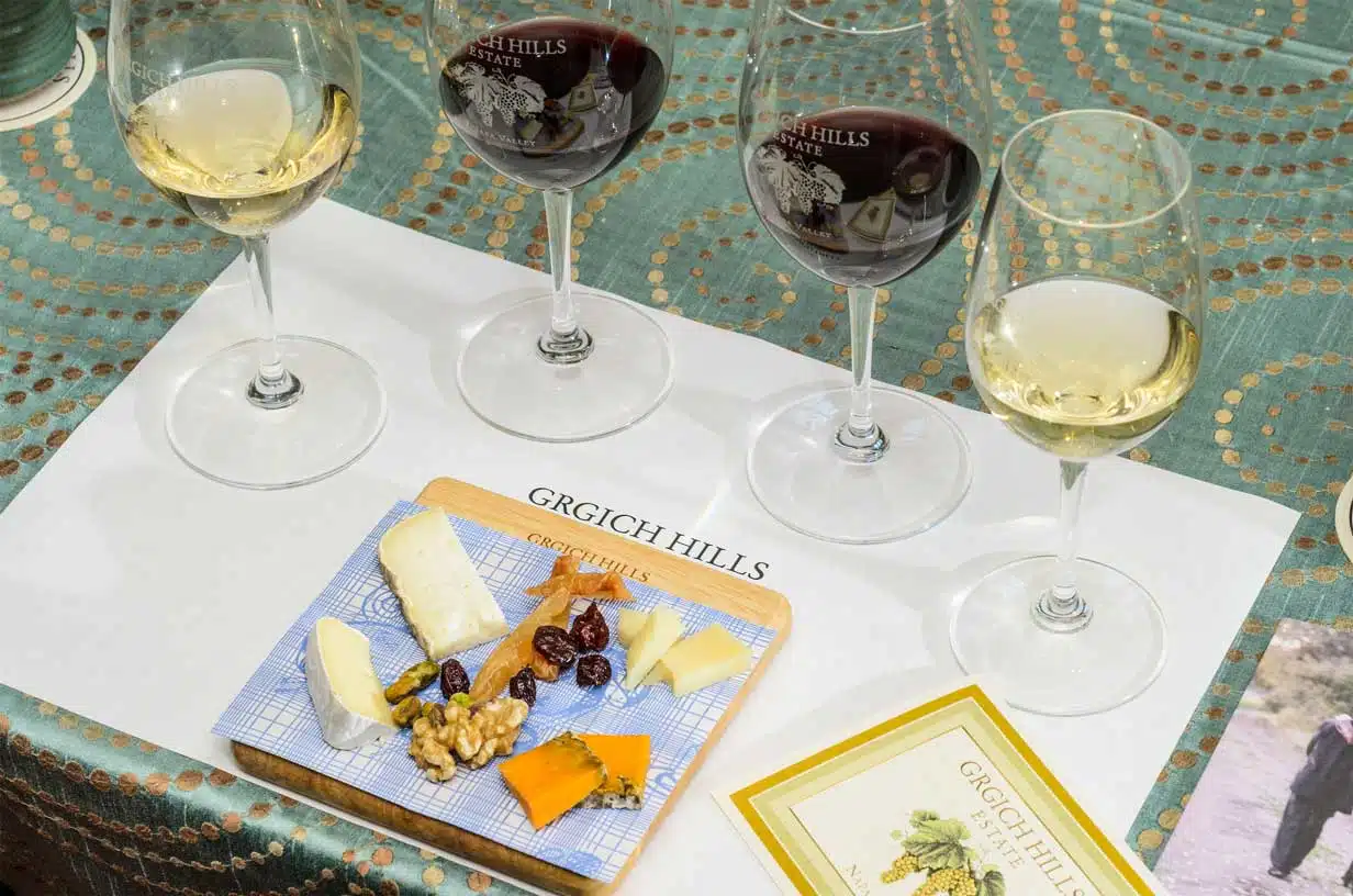 tasting-placemat glasses of wine and food on table