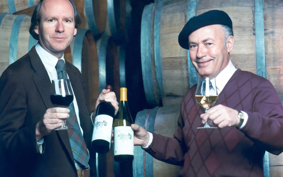 mike grgich holding wine bottle