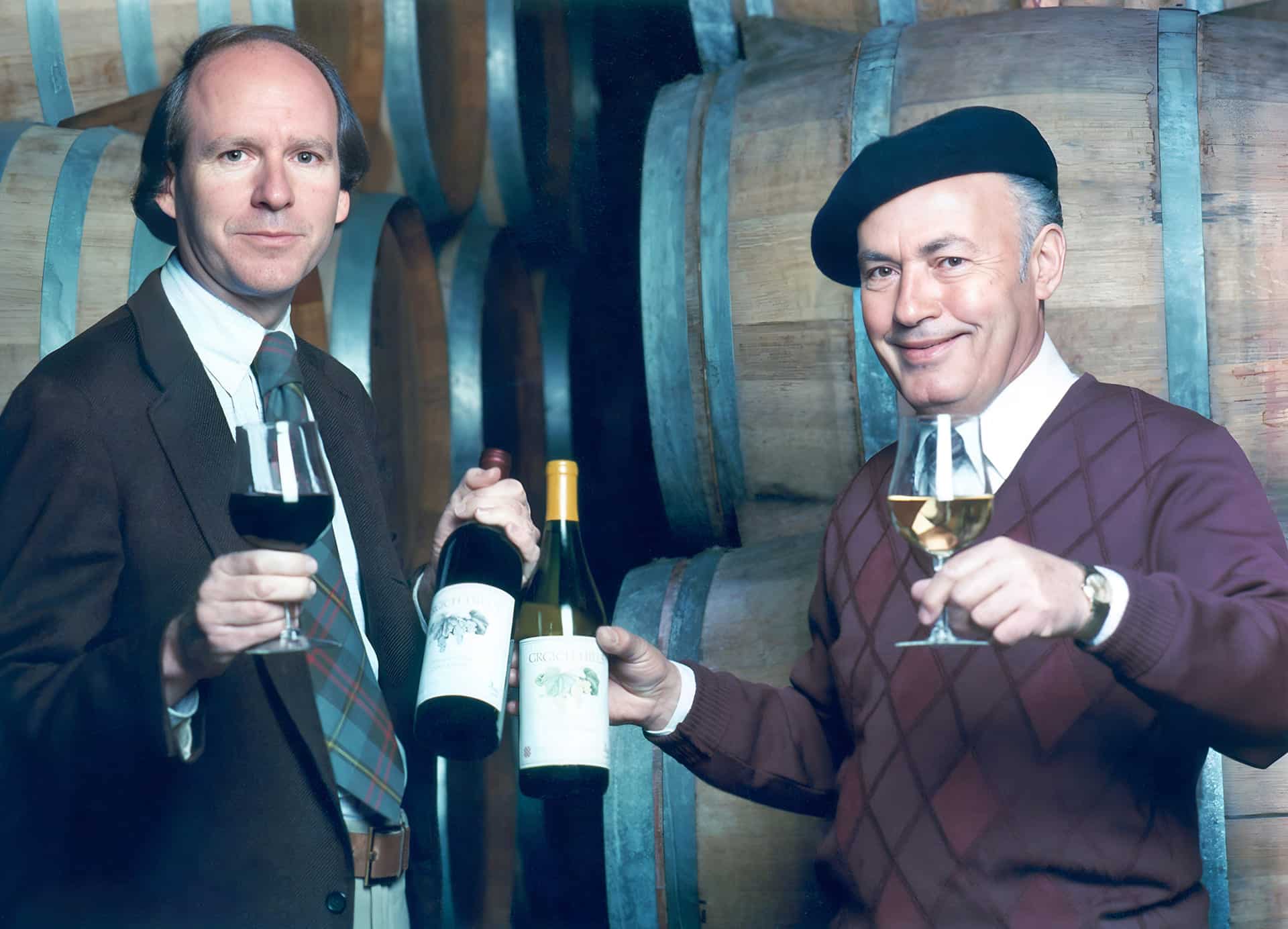 Header 1 (1) mike grgich holding wine bottle