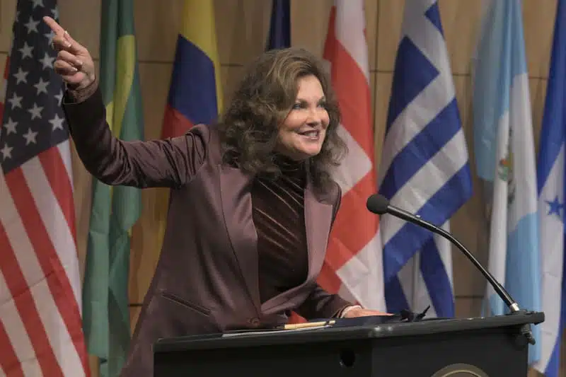festival of the bells recap 1 woman giving a speech