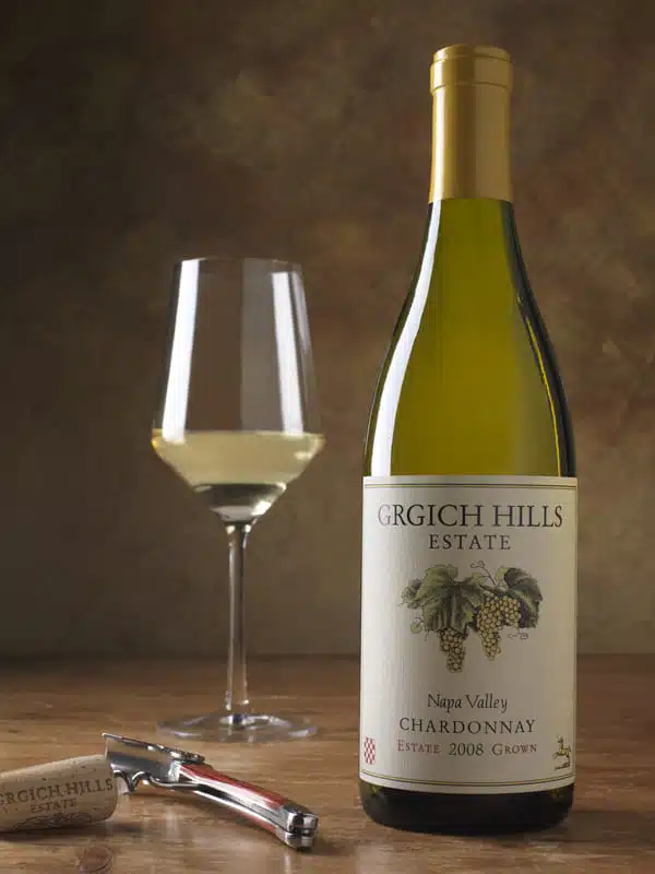12-23 seasonal sip Chardonnay (1) wine glass and wine bottle